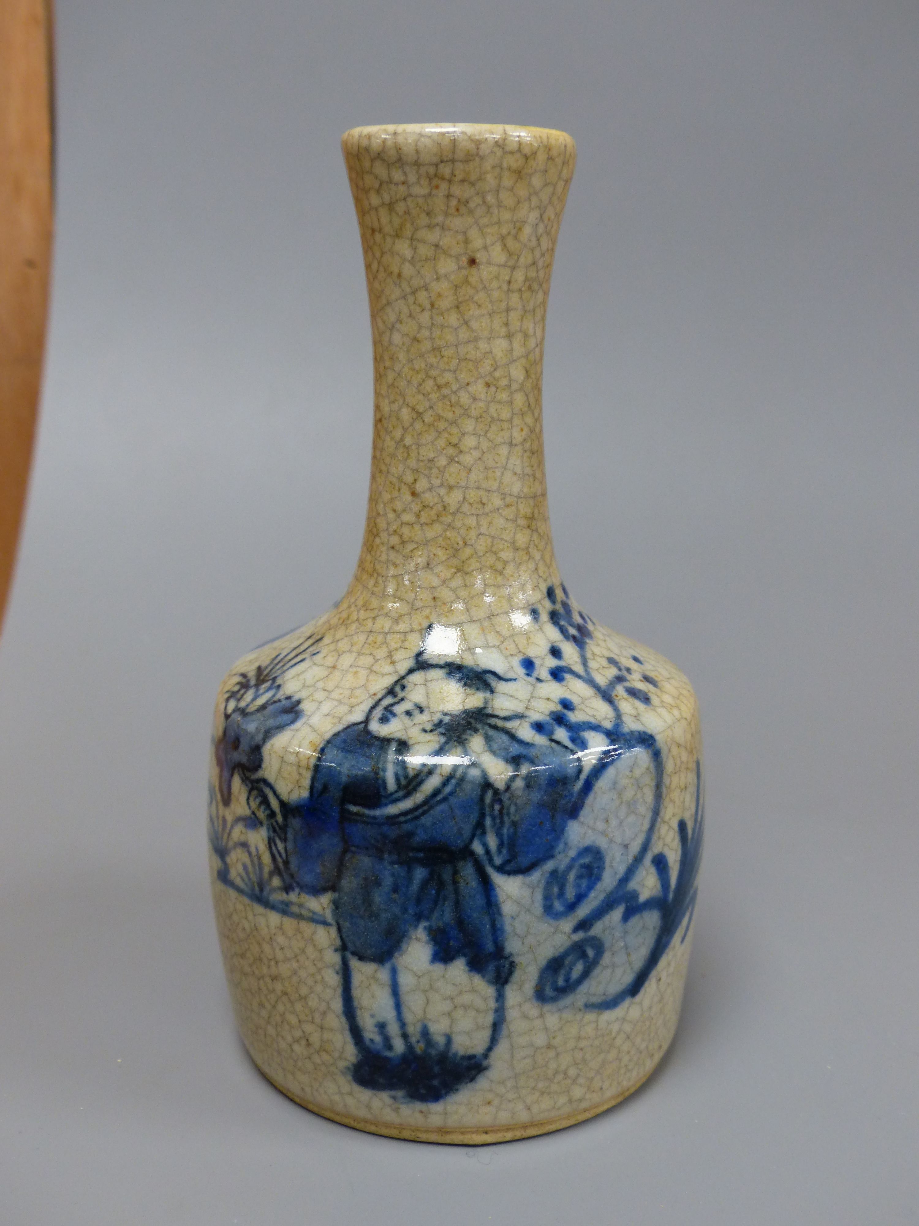 A Chinese blue and white crackle glaze bottle vase, height 15cm